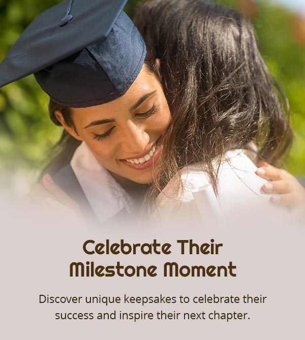 Celebrate Their Milestone Moment. Discover unique keepsakes to celebrate their success and inspire their next chapter. A graduate embracing a loved one, capturing a perfect moment for a graduation gift, especially a thoughtful graduation present for her.