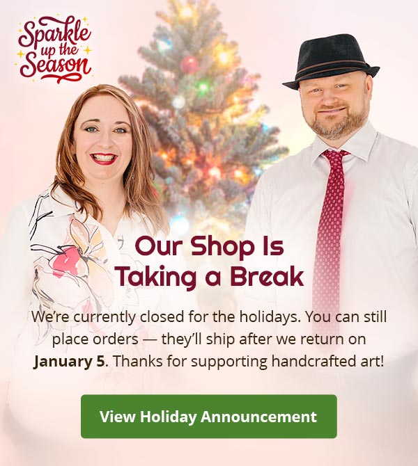 Jen and Chris Street standing in front of a Christmas tree with holiday-themed text and graphics. Text reads: Our Shop Is Taking a Break. We're currently closed for the holidays. You cacn still place orders — they'll ship after we return on January 5. Thanks for supporting handcrafted art! View Holiday Announcement. Logo lockup reads: Sparkle up the Season