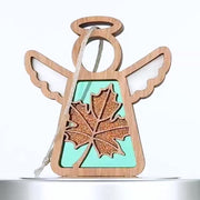 A rotating 360-degree view of the handcrafted Sugar Maple Leaf Mother’s Angels® ornament, featuring a vibrant orange maple leaf with sparkling accents set against a teal backdrop. The ornament’s wooden angel frame and delicate wings create a beautiful autumn-themed design. Perfect for an autumn decoration tree or as a part of fall mantel decor, this sugar maple leaf ornament symbolizes support and solidarity, with 30% of proceeds donated to Samaritan's Purse. Ideal for those seeking autumn decorations.
