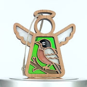 Wooden angel bird ornament with wings and a string for hanging. The body features a  stained glass–style image of a bird perched on a branch against a green background, making it an ideal gift for bird lovers.