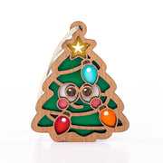 Front view of Twinkle Twinkle, a cute Christmas tree ornament with a face, gold star, and colorful bulbs