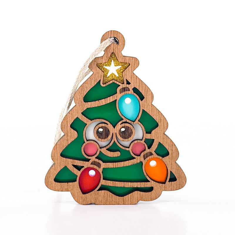 Front view of Twinkle Twinkle, a cute Christmas tree ornament with a face, gold star, and colorful bulbs