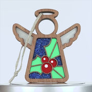 A holly ornament featuring a vibrant and colorful design, crafted from wood.