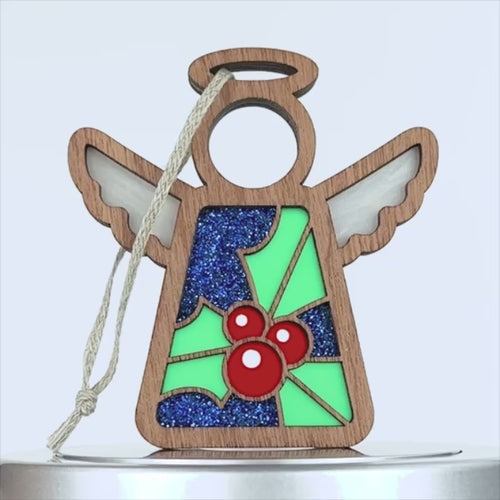 A holly ornament featuring a vibrant and colorful design, crafted from wood.