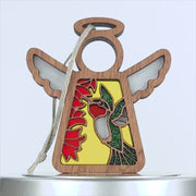 A wooden angel with a colorful design, gracefully accompanied by a delicate hummingbird ornament.